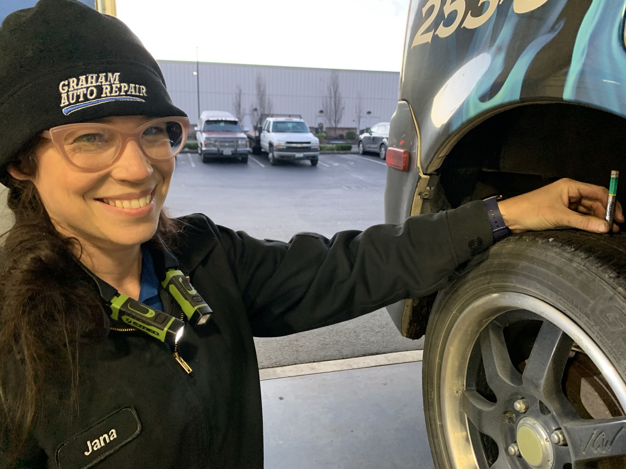 Graham Auto Repair Technician Jana Checking Tire Tread Depth